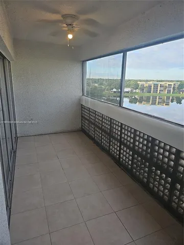 an aerial view of a houses with a lake view