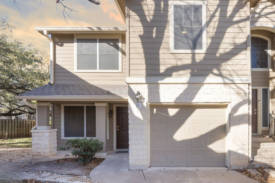 4400 Switch Willo, Unit 12 Austin, TX 78727 - Photo 1 of 23 a front view of a house with a glass windows