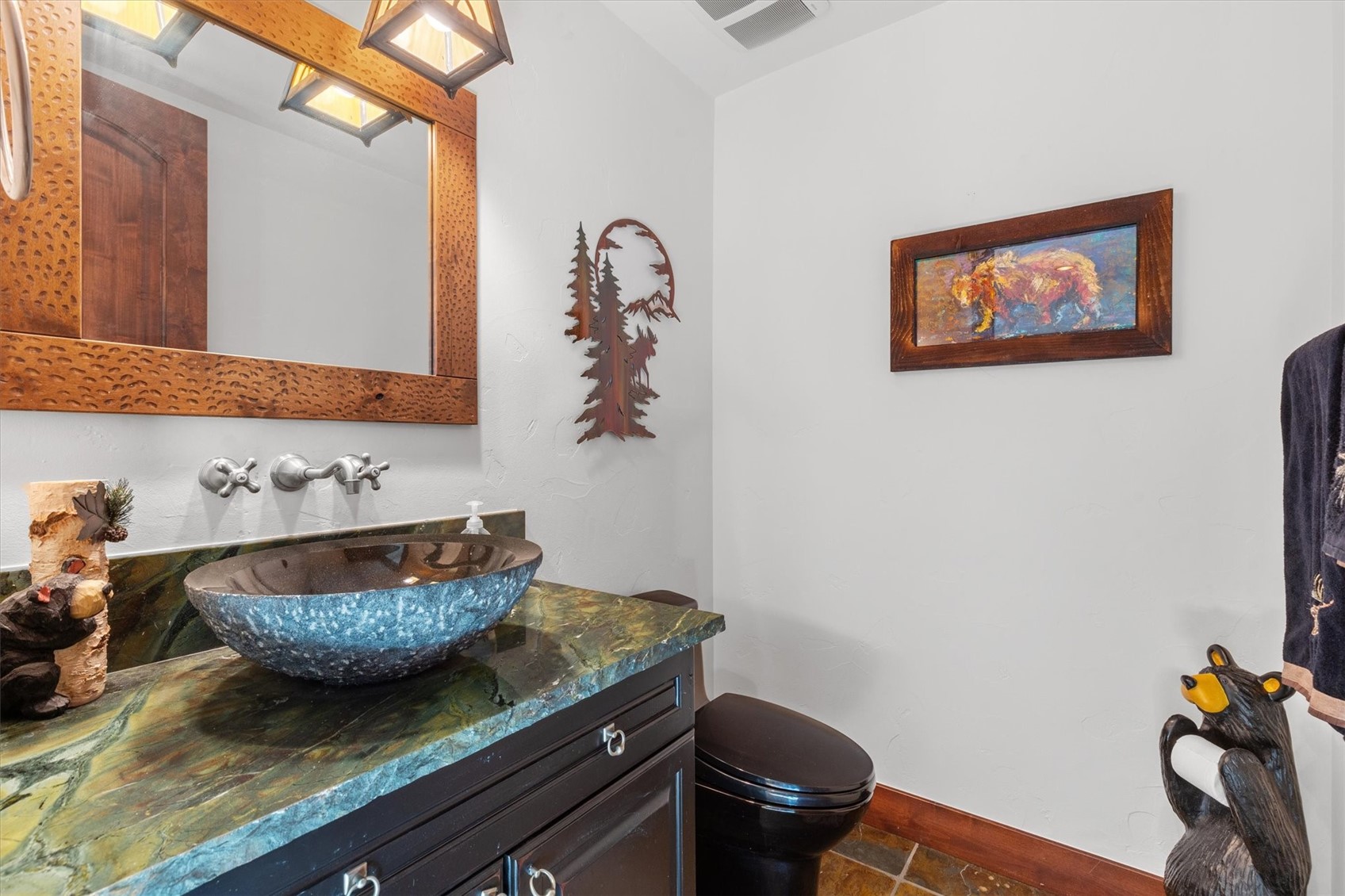 2324 Glacier Ridge, Unit B Steamboat Springs, CO 80487 - Photo 21 of 46 Half bathroom with vanity and stone tile flooring