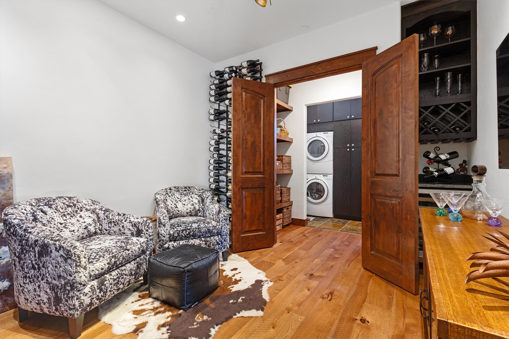 2324 Glacier Ridge, Unit B Steamboat Springs, CO 80487 - Photo 23 of 46 Sitting room with light wood-style flooring and estacked washer and dryer