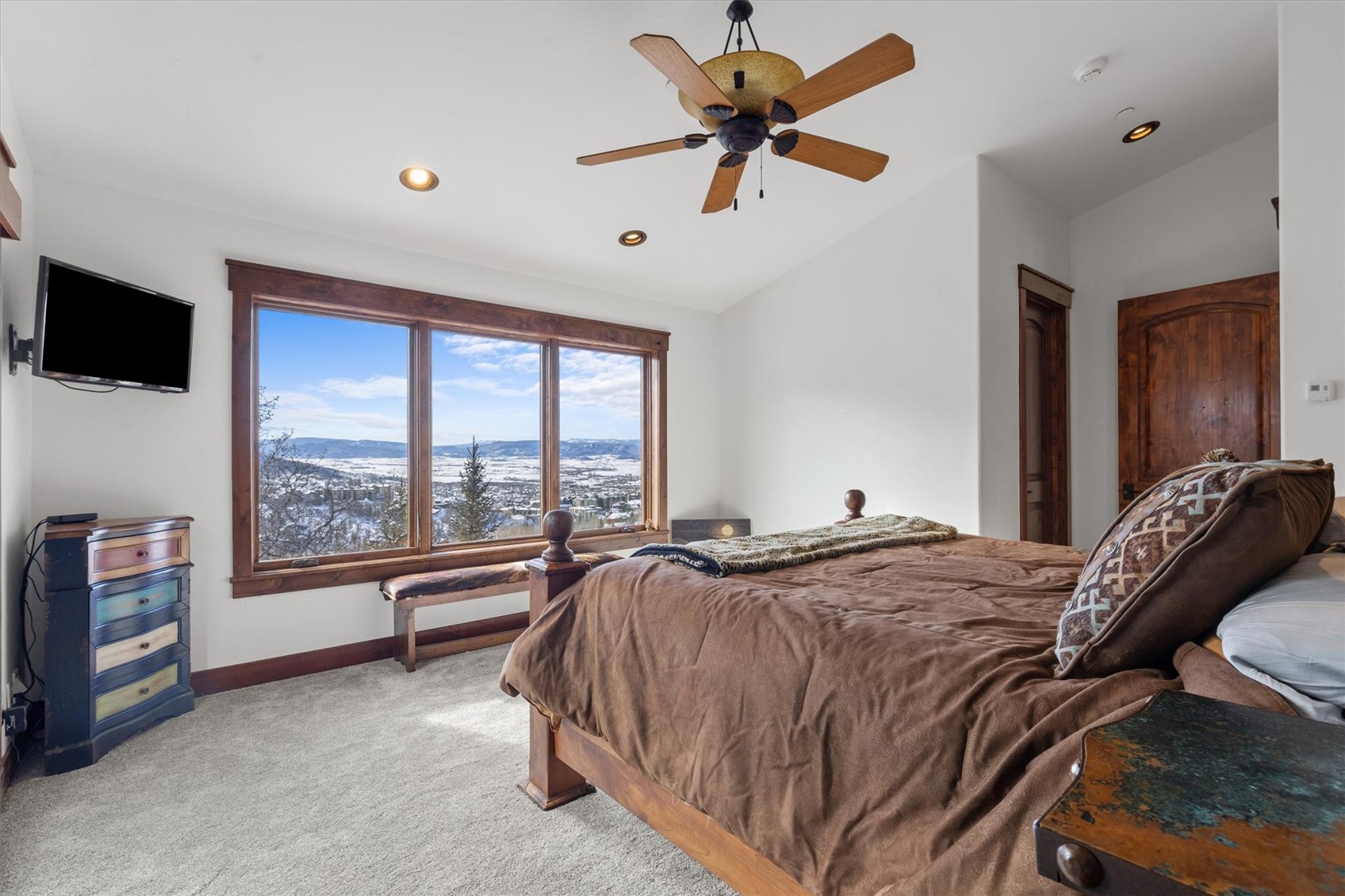 2324 Glacier Ridge, Unit B Steamboat Springs, CO 80487 - Photo 36 of 46 Bedroom with lofted ceiling, light carpet, ceiling fan, and recessed lighting