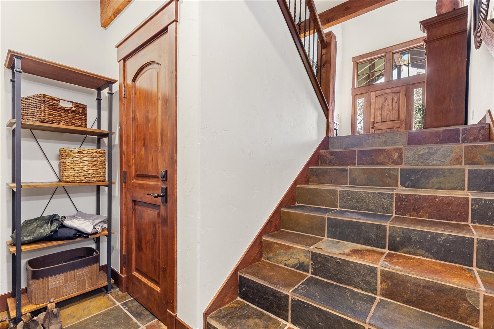 2324 Glacier Ridge, Unit B Steamboat Springs, CO 80487 - Photo 43 of 46 Stairs featuring stone tile flooring and baseboards