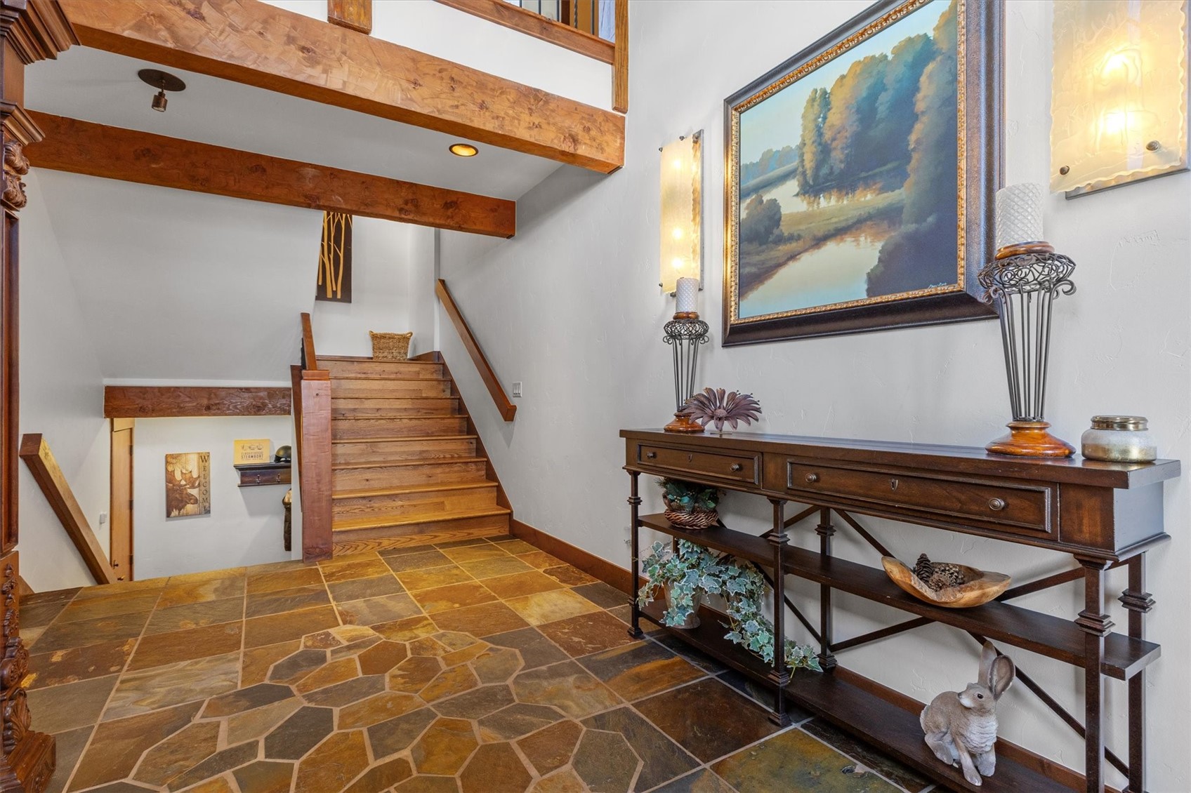2324 Glacier Ridge, Unit B Steamboat Springs, CO 80487 - Photo 5 of 46 Staircase with stone flooring, recessed lighting, and beamed ceiling