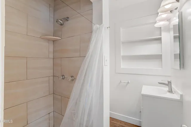 a bathroom with a sink and shower