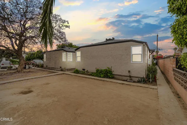 a view of a house with a street