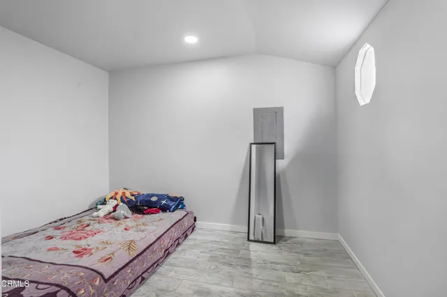 a view of a bedroom with baby bed