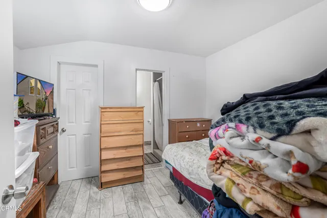 a bedroom with a bed and furniture