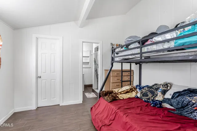 a bed room with a bed and a couch