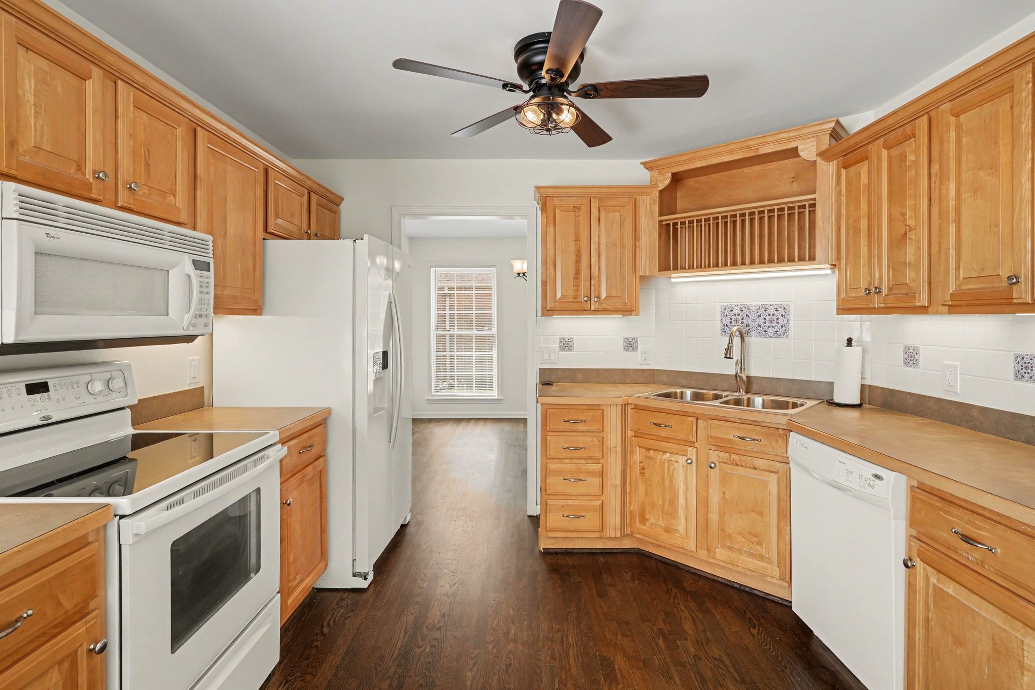 161 Fieldstone Lane Springfield, TN 37172 - Photo 7 of 26 a kitchen with stainless steel appliances a stove a sink and white cabinets