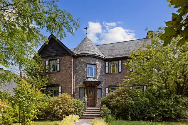 front view of a house with a fountain