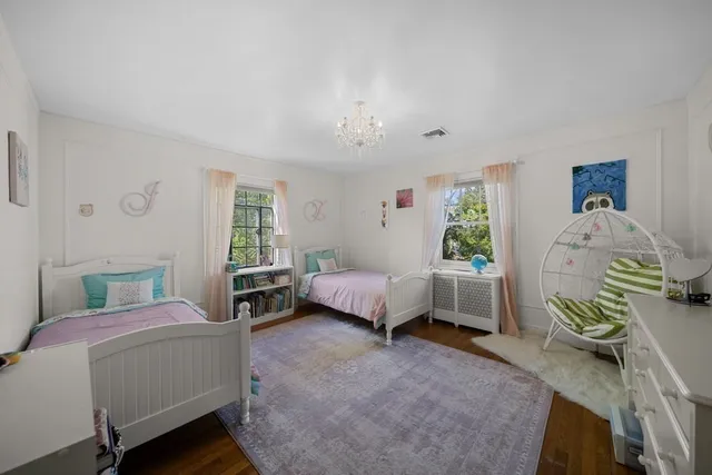 a bedroom with furniture and a window