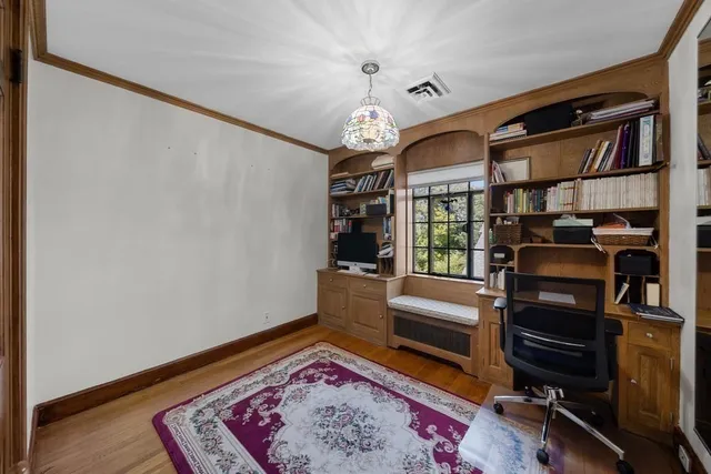 a view of a livingroom with furniture and a window