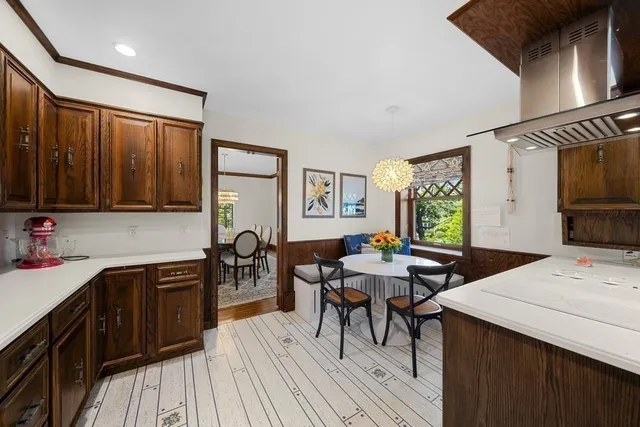 a kitchen with lots of counter top space and dining table