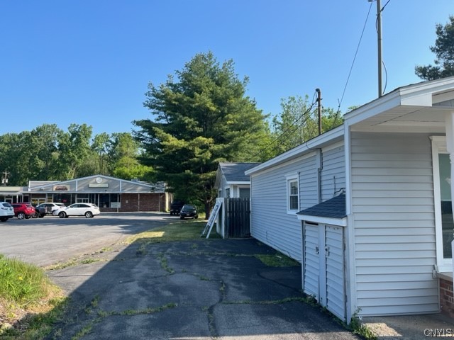 245 East Main Street Elbridge, NY 13060 - Photo 4 of 22 Rear of the building with apartment entry.