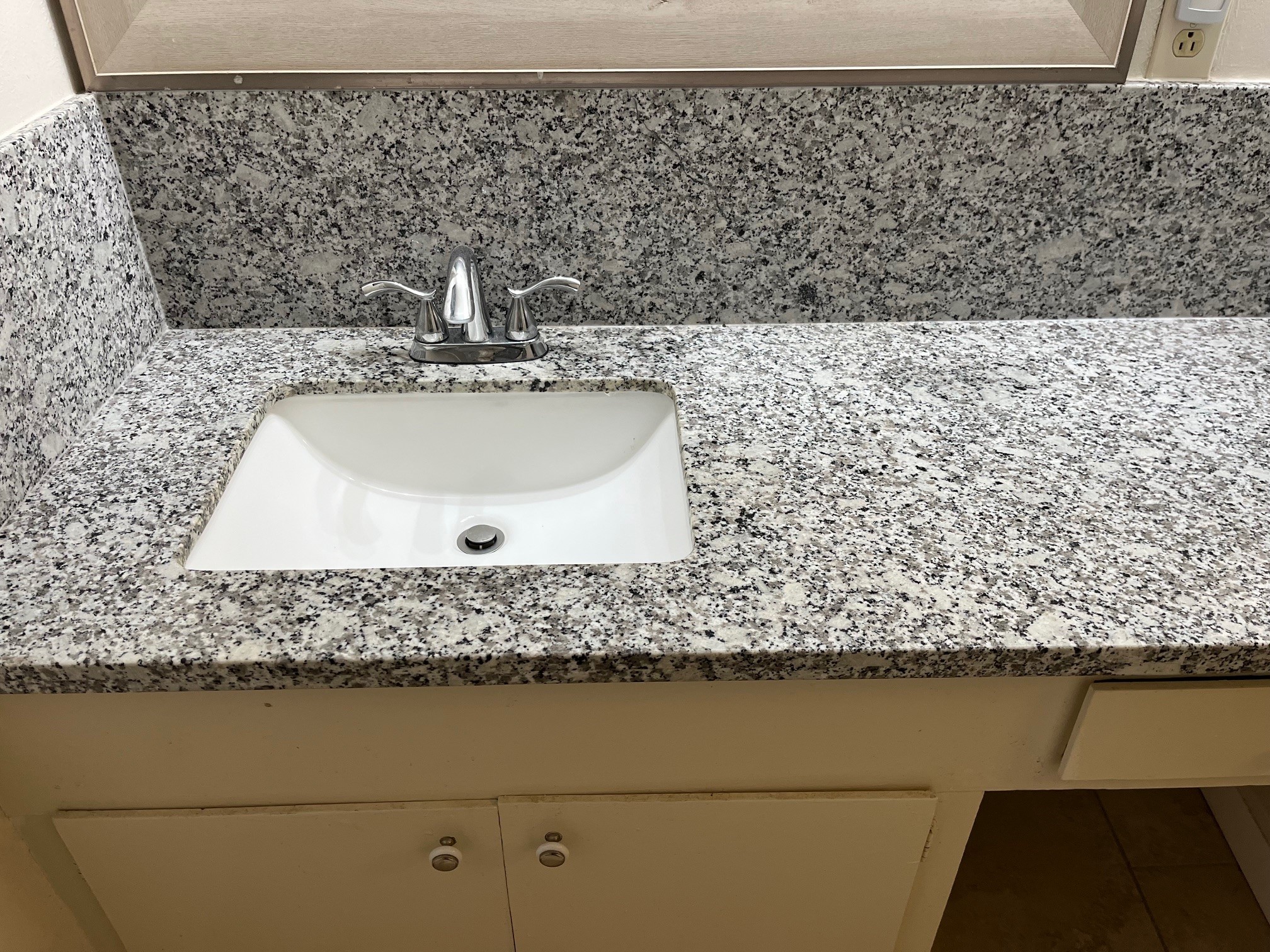 3938 West Alabama Street, Unit 12 Houston, TX 77027 - Photo 19 of 25 Close-up of granite vanity countertop with undermount sink & updated faucet.