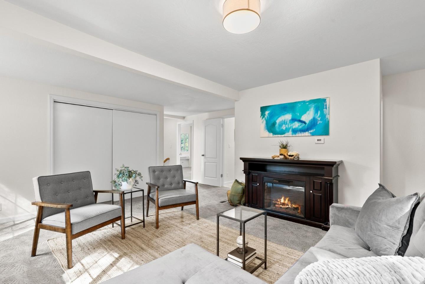 600 Cook Way Ben Lomond, CA 95005 - Photo 25 of 36 a living room with furniture a flat screen tv and a fireplace