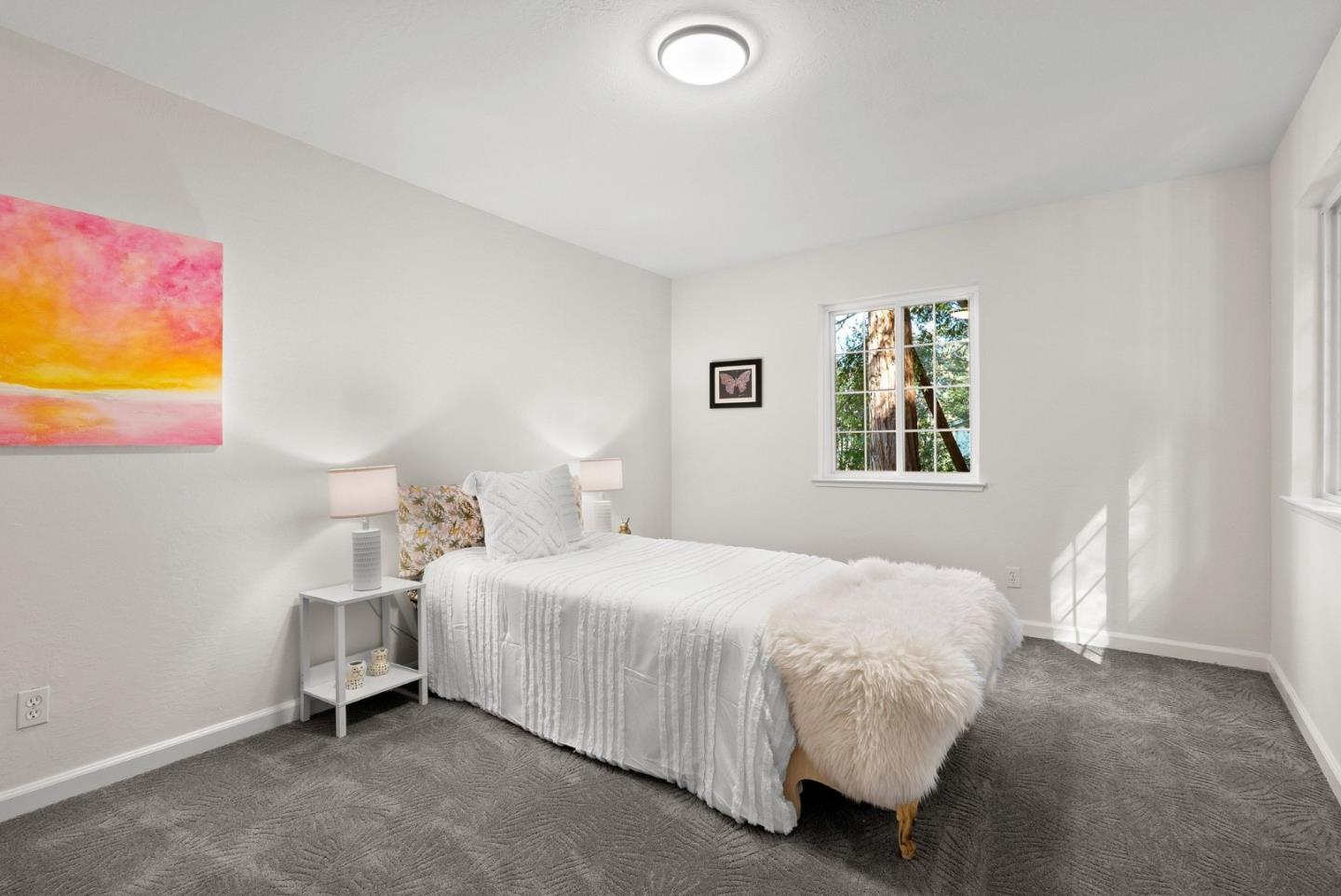 600 Cook Way Ben Lomond, CA 95005 - Photo 27 of 36 a bedroom with a bed and painting on the wall