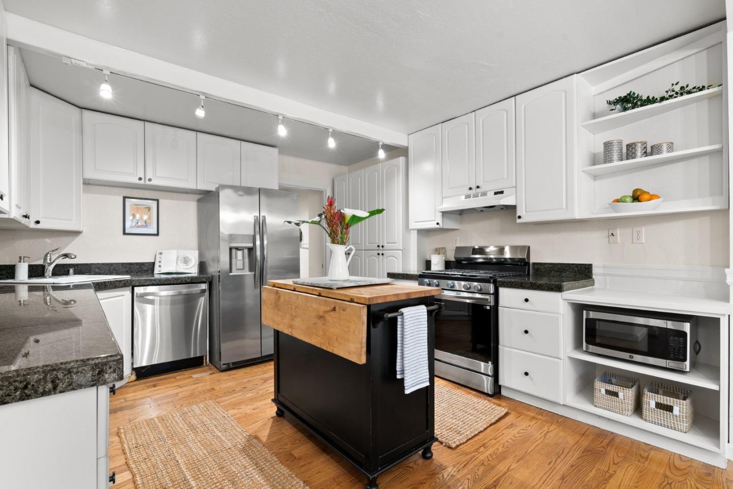 600 Cook Way Ben Lomond, CA 95005 - Photo 10 of 36 a kitchen with stainless steel appliances granite countertop a stove a sink and a refrigerator