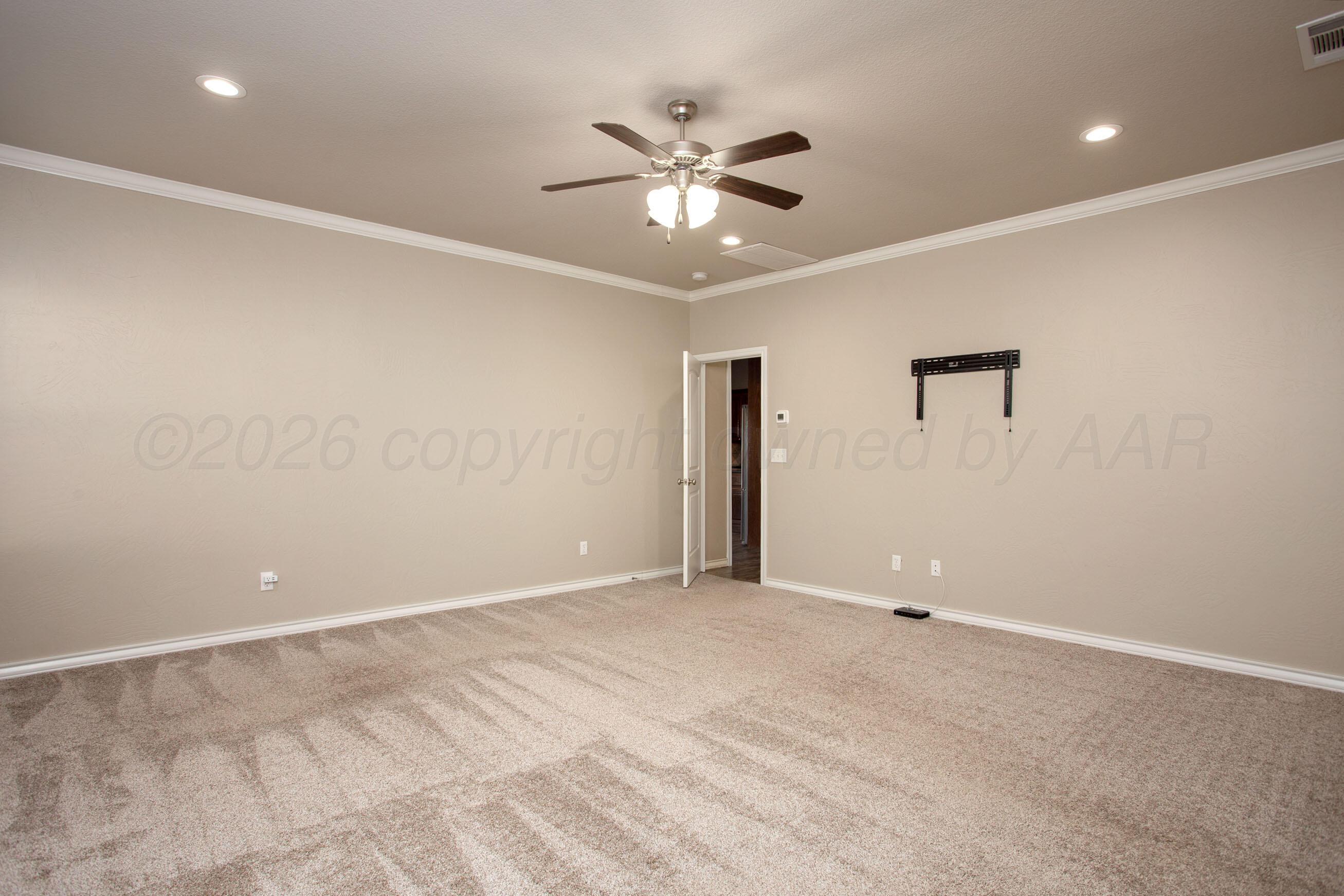 18400 Sundancer Lane Bushland, TX 79124 - Photo 16 of 58 an empty room with a ceiling fan and a window