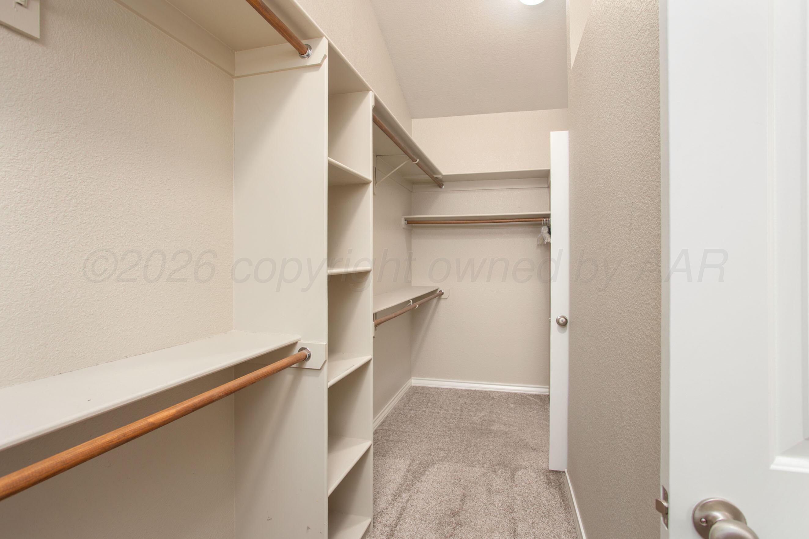 18400 Sundancer Lane Bushland, TX 79124 - Photo 20 of 58 a view of walk in closet with empty racks