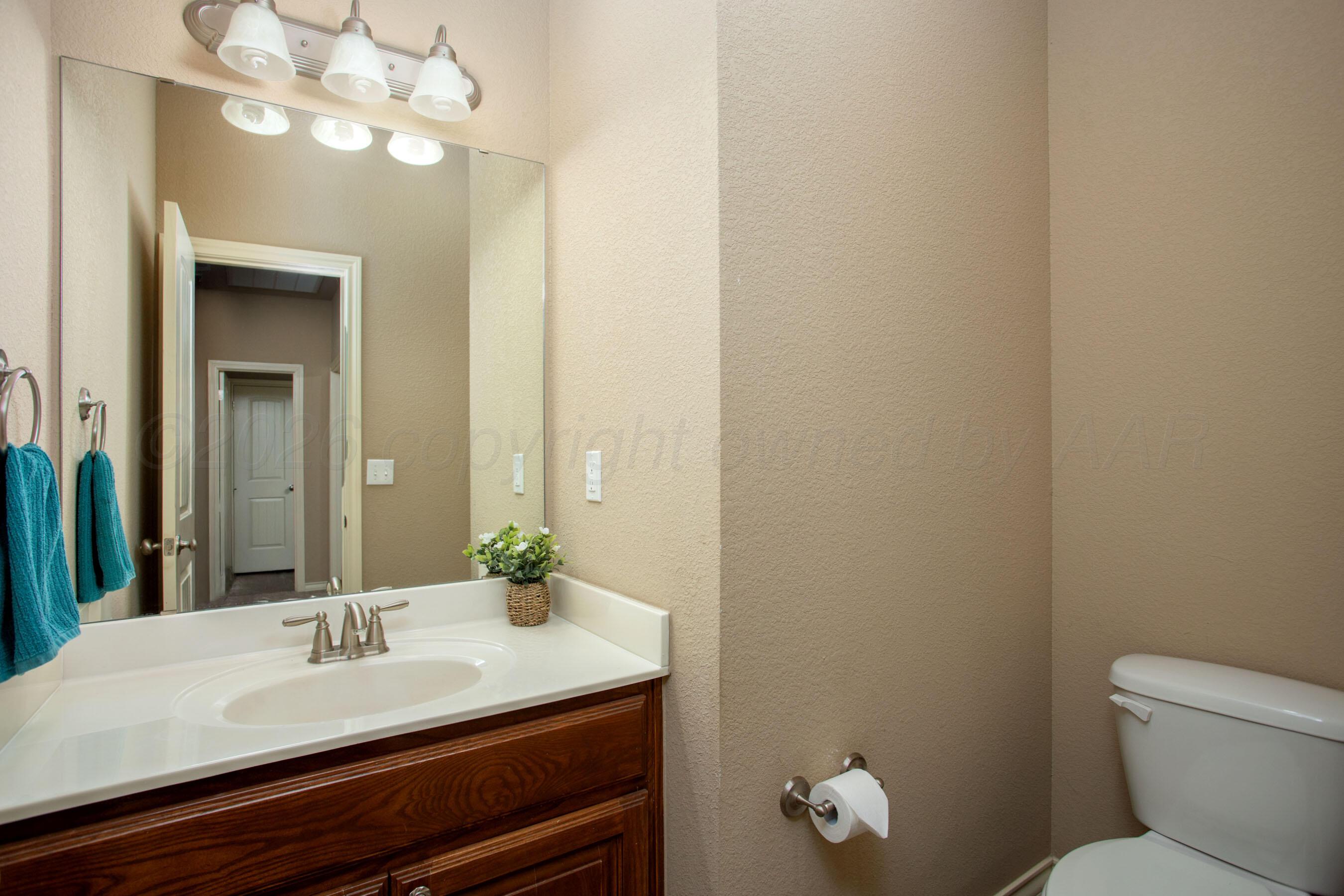 18400 Sundancer Lane Bushland, TX 79124 - Photo 35 of 58 a bathroom with a sink vanity and a mirror