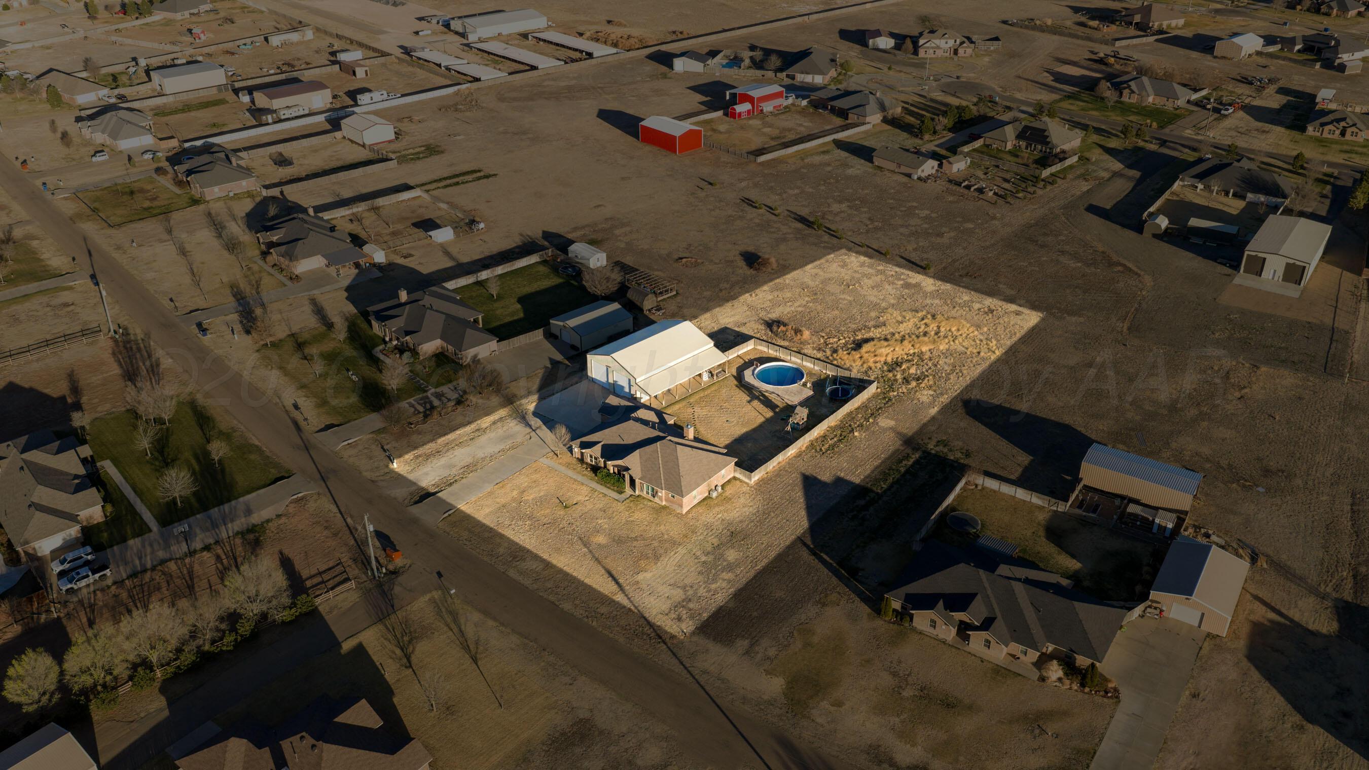 18400 Sundancer Lane Bushland, TX 79124 - Photo 51 of 58 an aerial view of a backyard with table and chairs
