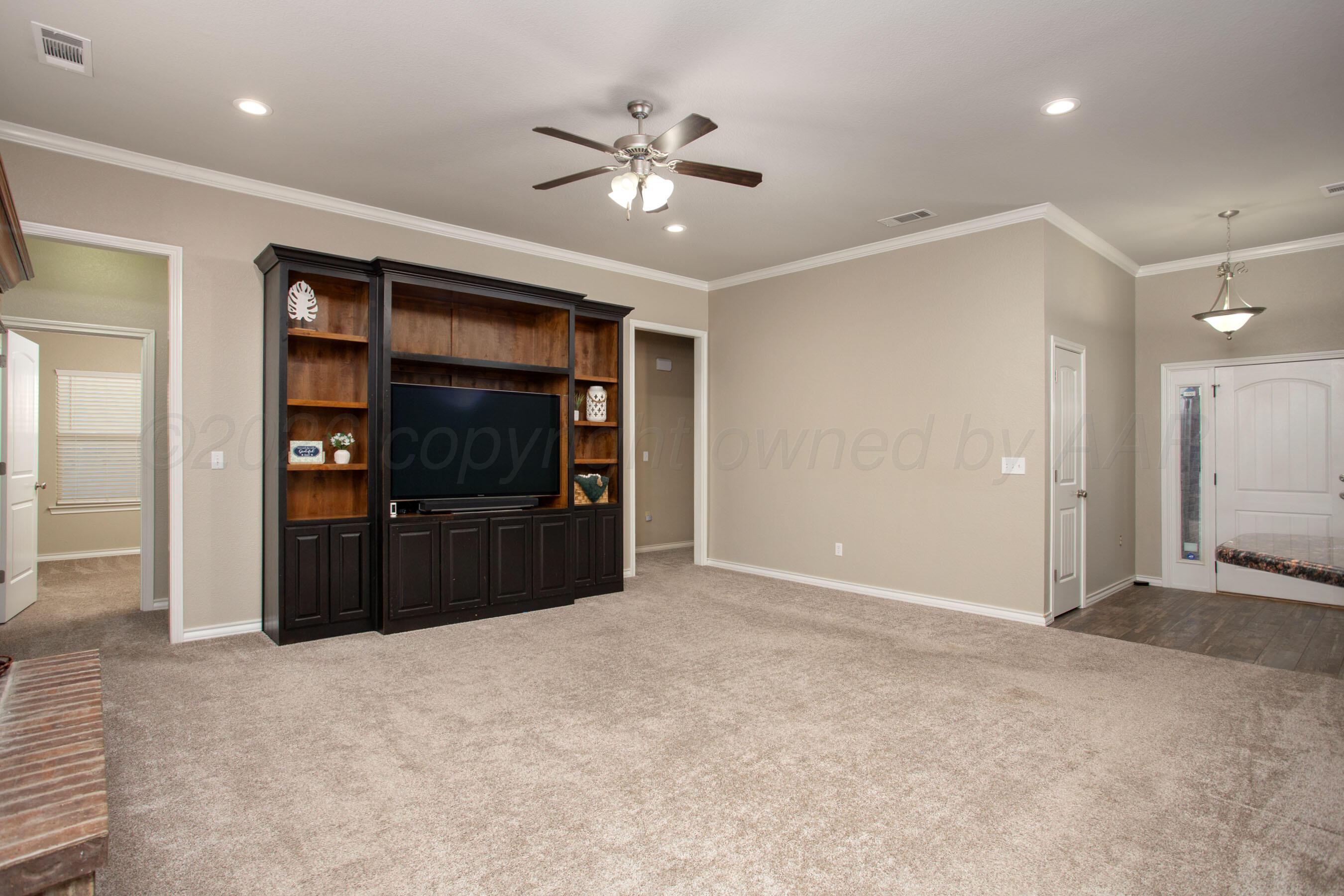 18400 Sundancer Lane Bushland, TX 79124 - Photo 6 of 58 a view of a livingroom with a chandelier fan and closet