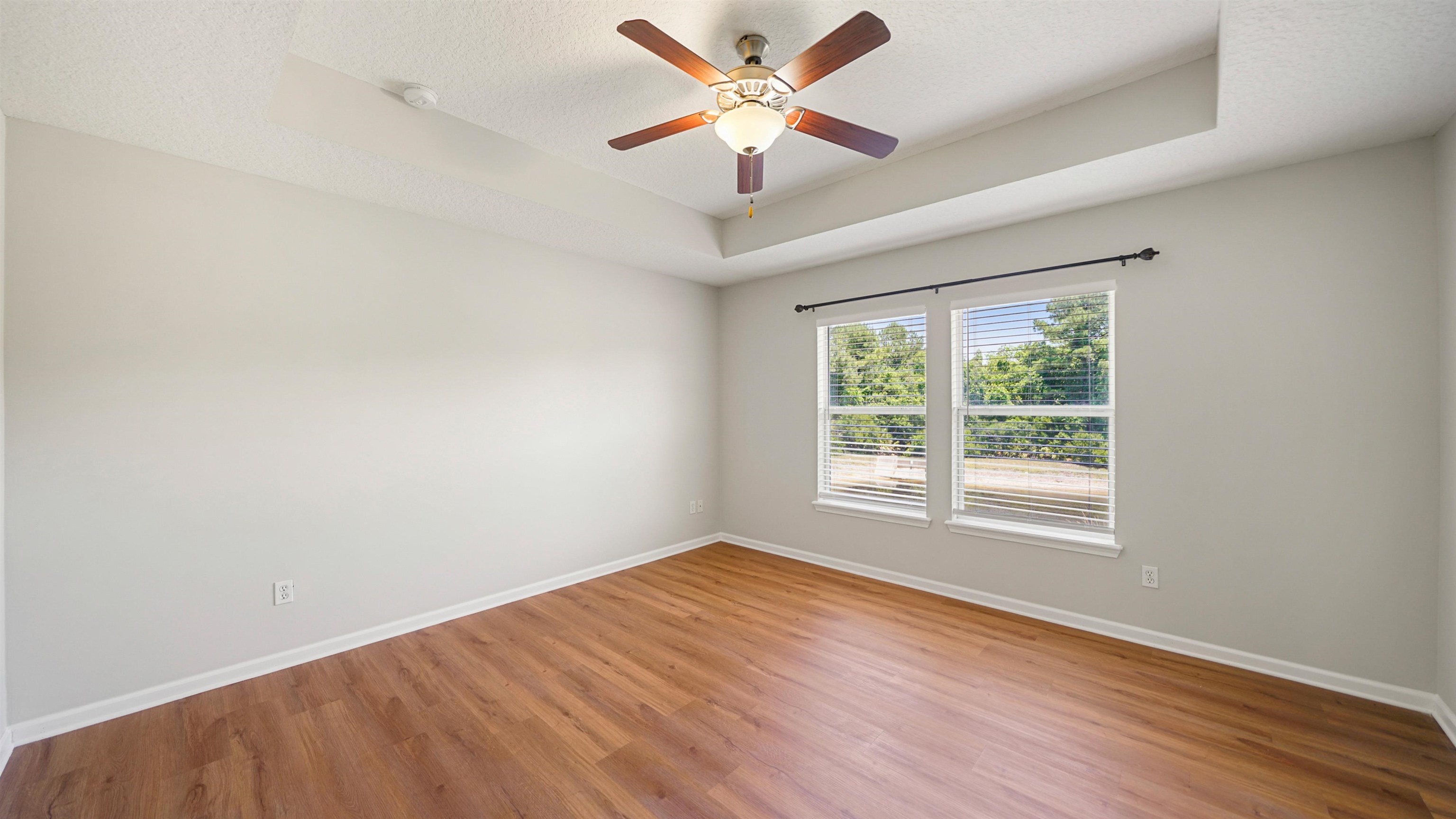 18 Amistad Drive, Unit 18 St. Augustine, FL 32086 - Photo 15 of 36 an empty room with a window and a fan