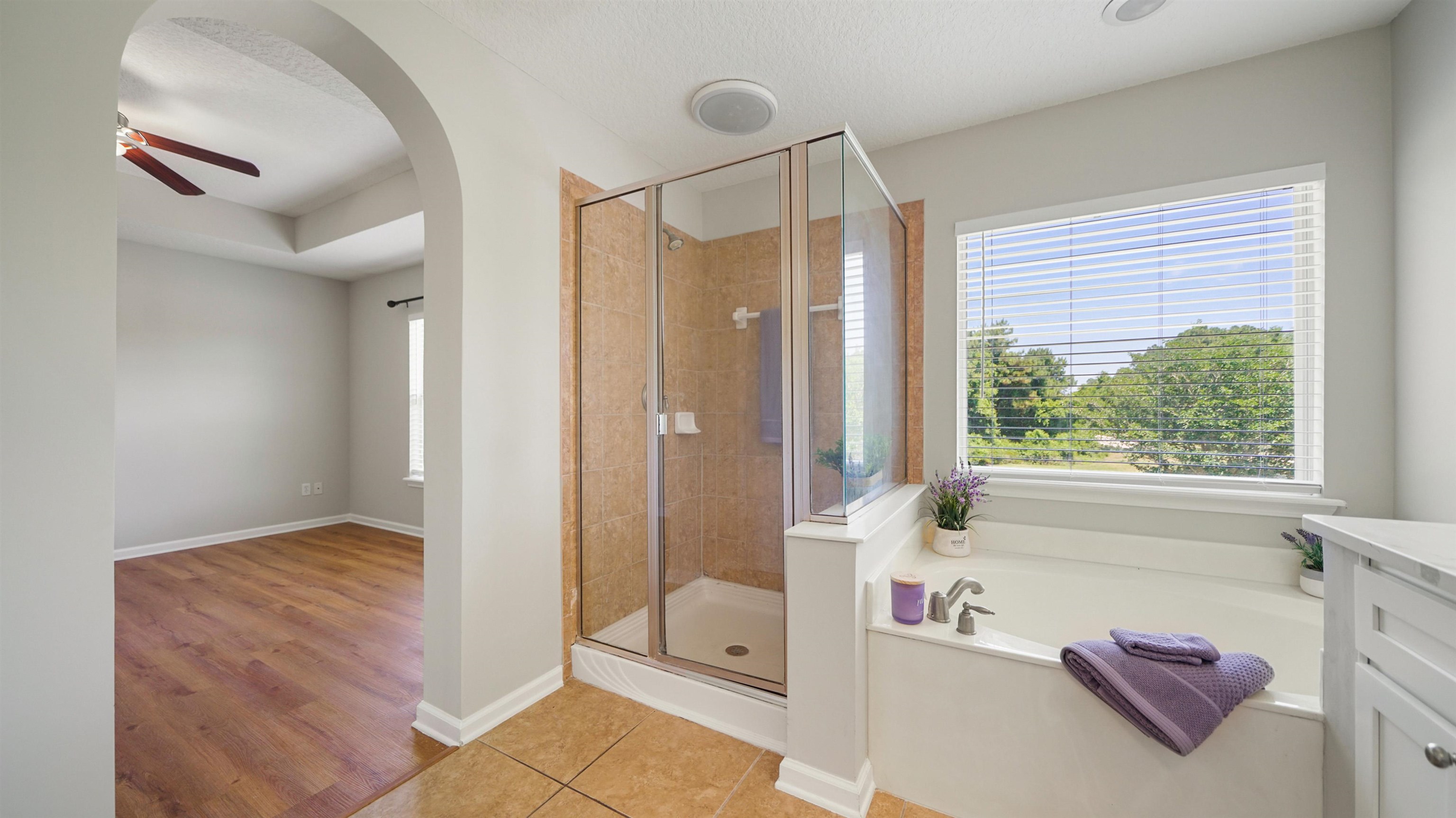 18 Amistad Drive, Unit 18 St. Augustine, FL 32086 - Photo 20 of 36 a spacious bathroom with a tub shower and windows