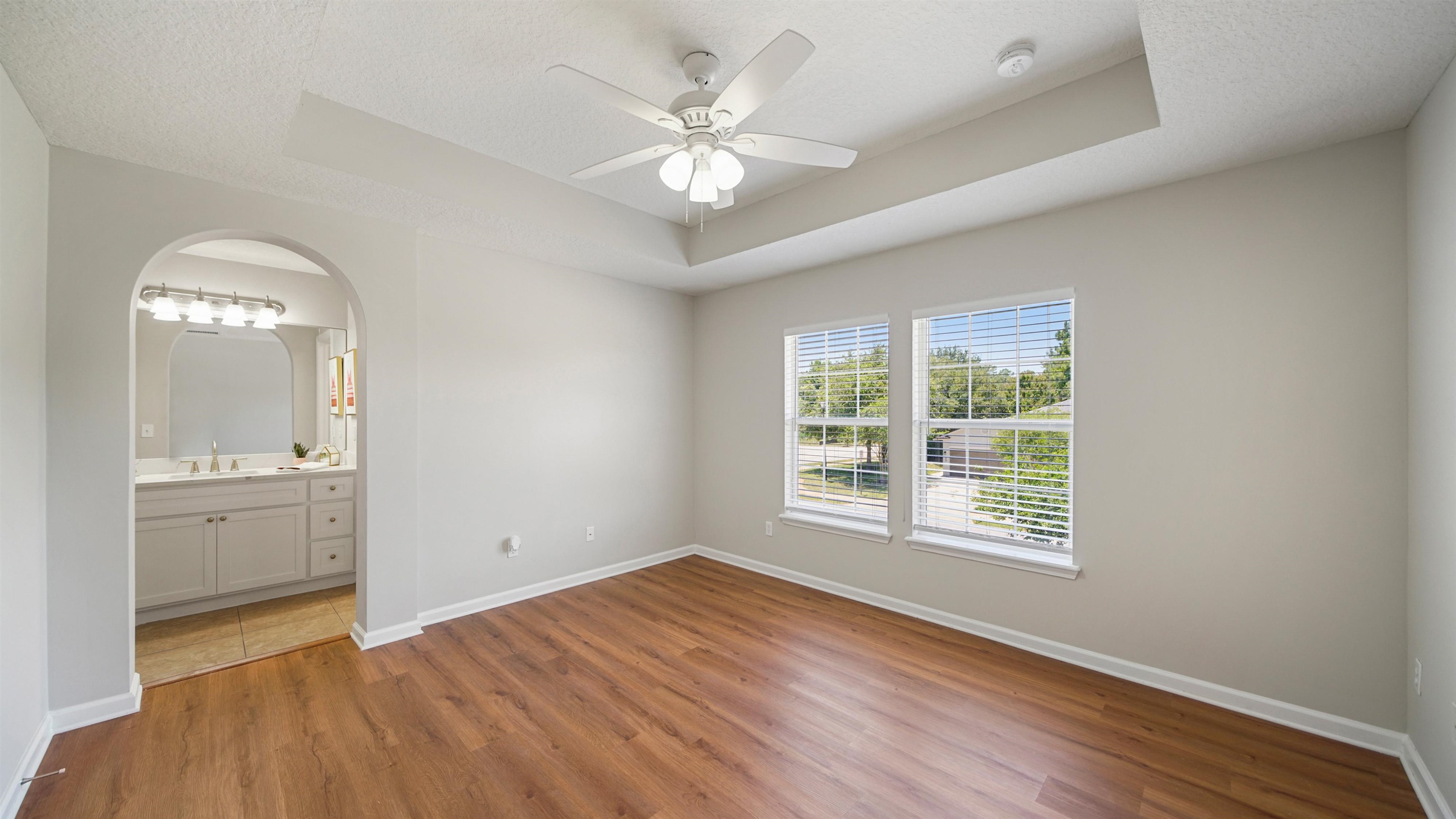 18 Amistad Drive, Unit 18 St. Augustine, FL 32086 - Photo 21 of 36 wooden floor in an empty room with a window