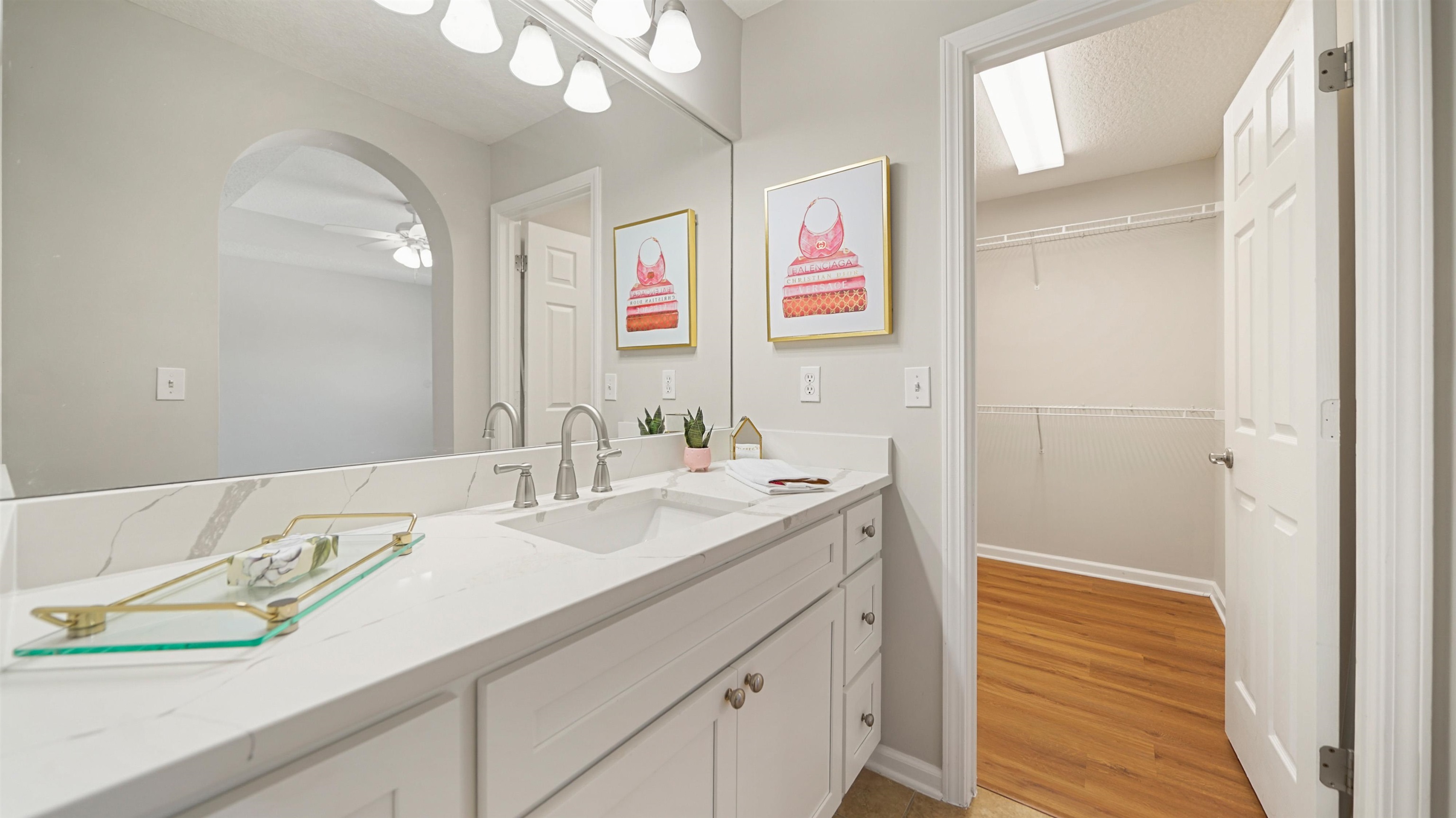 18 Amistad Drive, Unit 18 St. Augustine, FL 32086 - Photo 25 of 36 a bathroom with a sink a vanity and a mirror