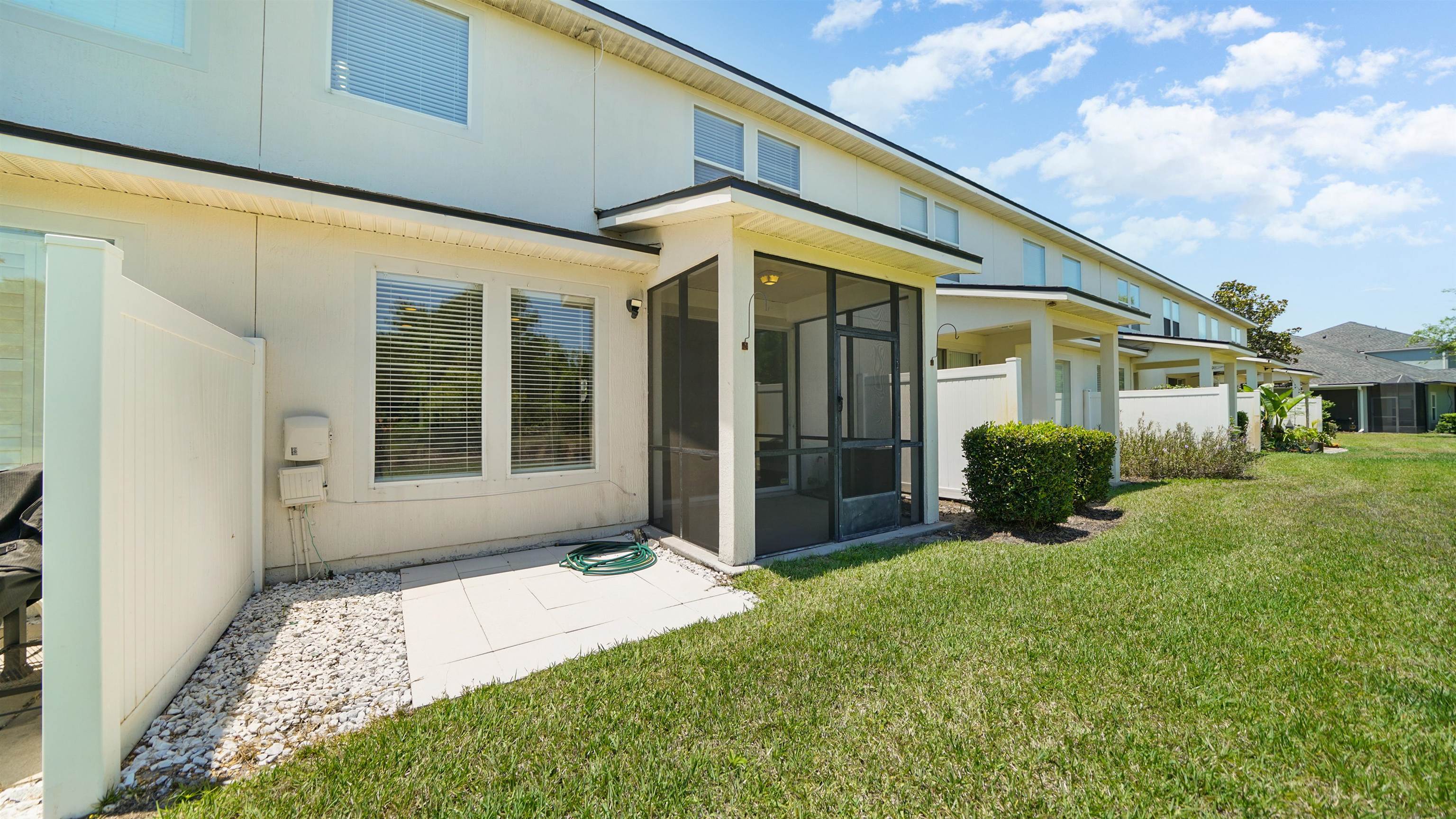 18 Amistad Drive, Unit 18 St. Augustine, FL 32086 - Photo 28 of 36 a view of a house with backyard and porch