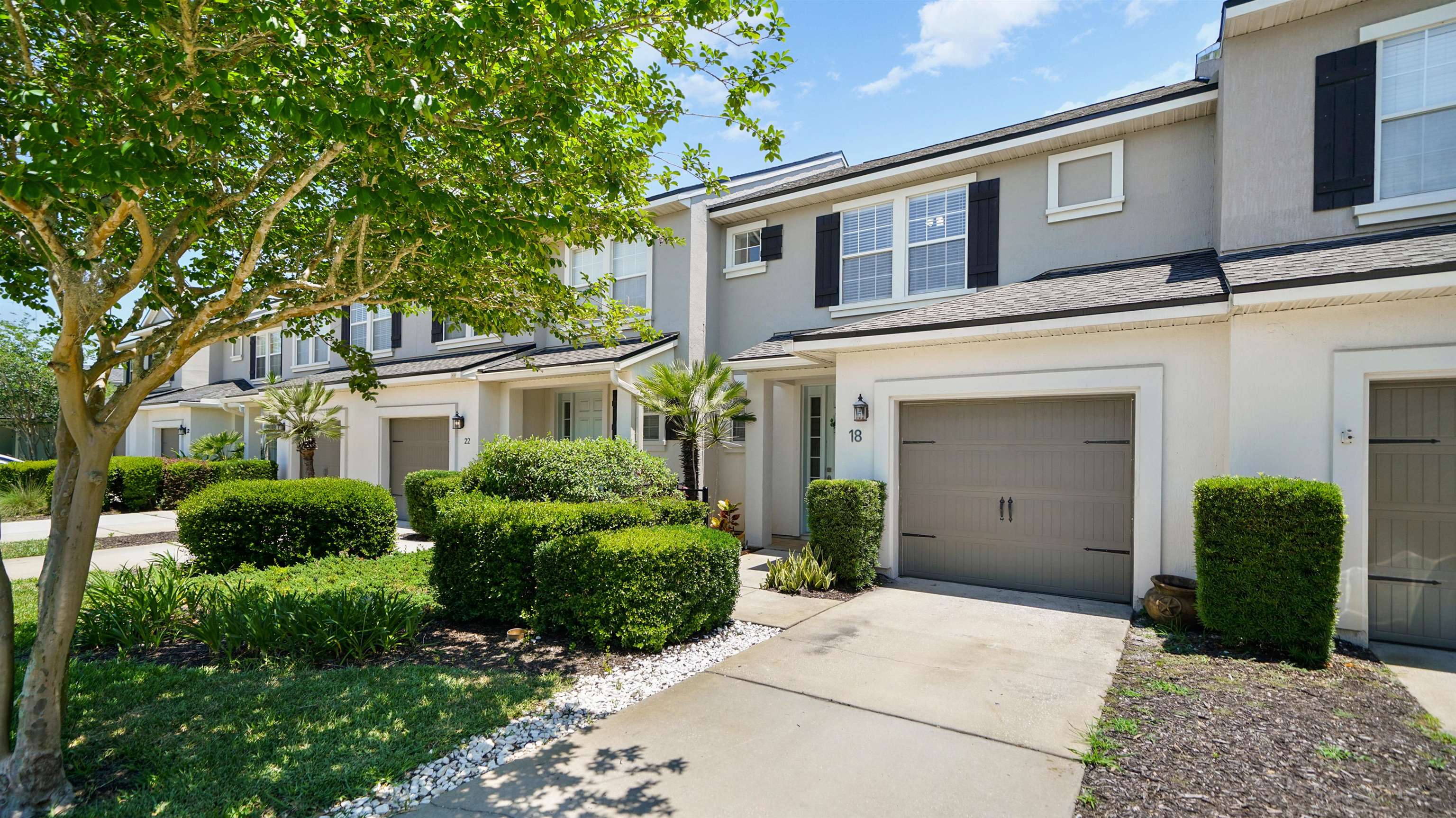 18 Amistad Drive, Unit 18 St. Augustine, FL 32086 - Photo 33 of 36 front view of a house with a yard