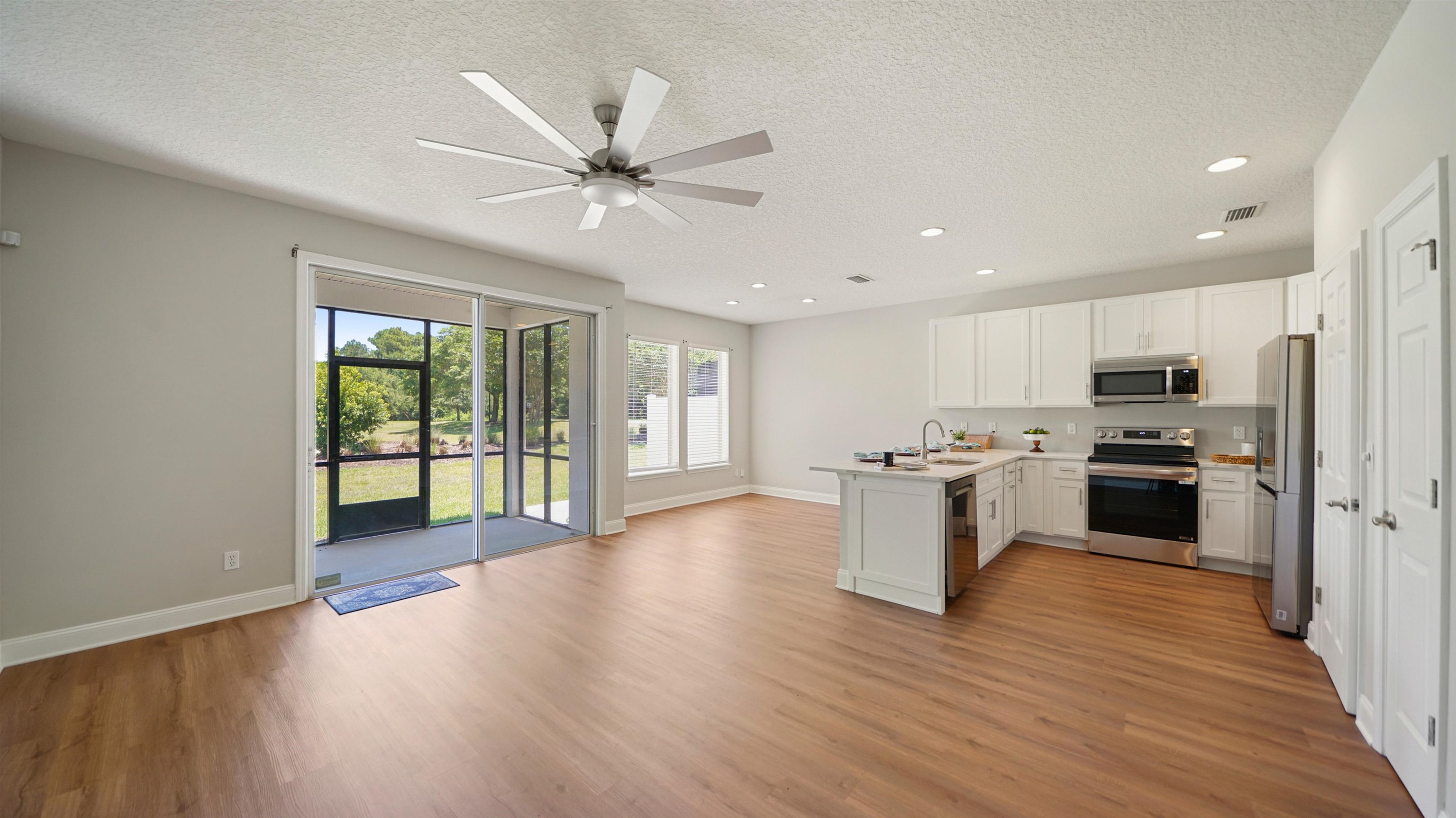 18 Amistad Drive, Unit 18 St. Augustine, FL 32086 - Photo 5 of 36 a kitchen with a stove a sink and a refrigerator
