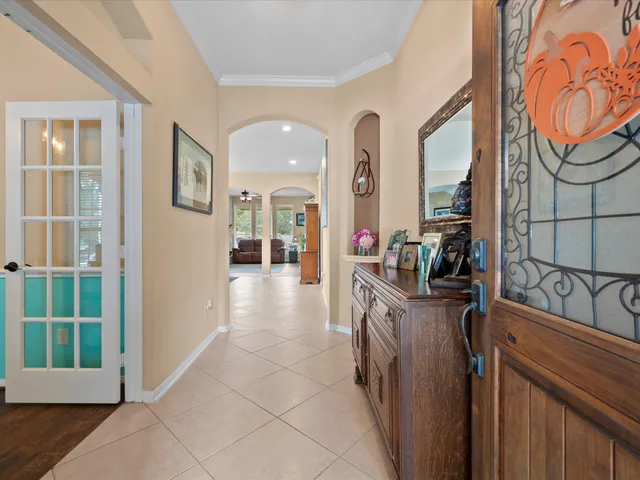 a kitchen with granite countertop a sink and a refrigerator