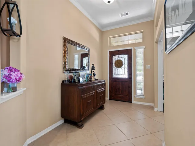 a kitchen with granite countertop a sink stove and refrigerator