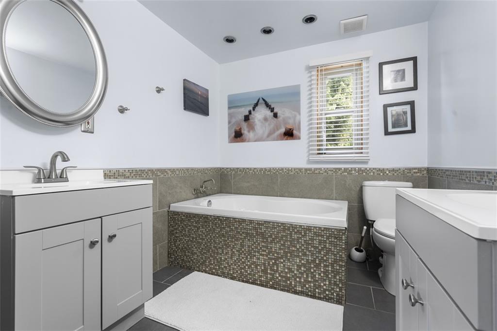 920 Mifflinridge Road Pittsburgh, PA 15207 - Photo 15 of 34 Main level bathroom features double sinks and a jet spray tub!