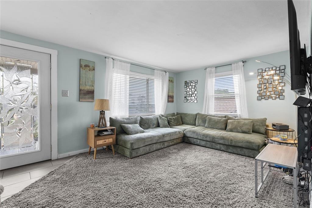 920 Mifflinridge Road Pittsburgh, PA 15207 - Photo 4 of 34 Inviting living room with lots of natural light, perfect for relaxation and entertaining.