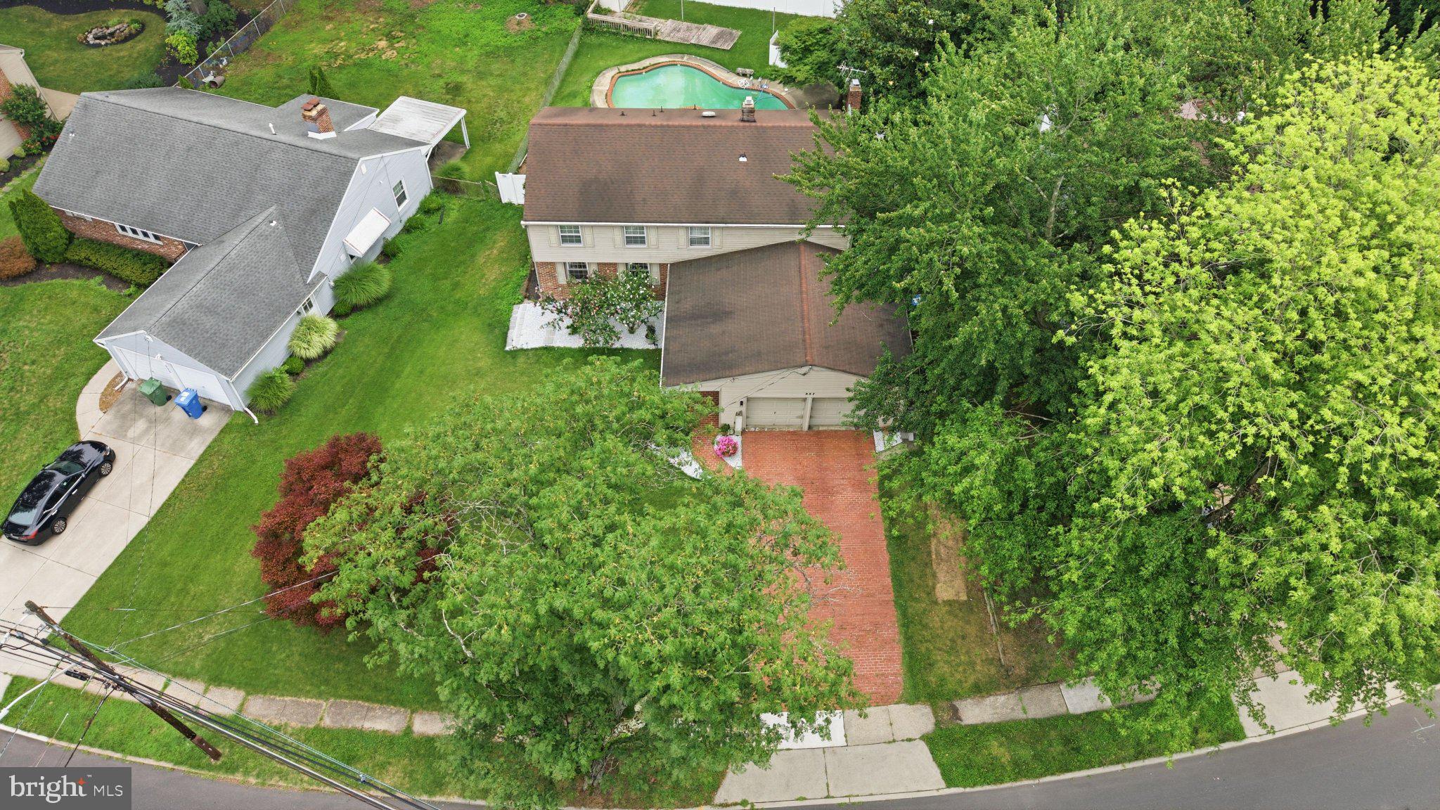 557 Covered Bridge Road Cherry Hill, NJ 08034 - Photo 40 of 43 Lush greenery surrounds a cozy home.