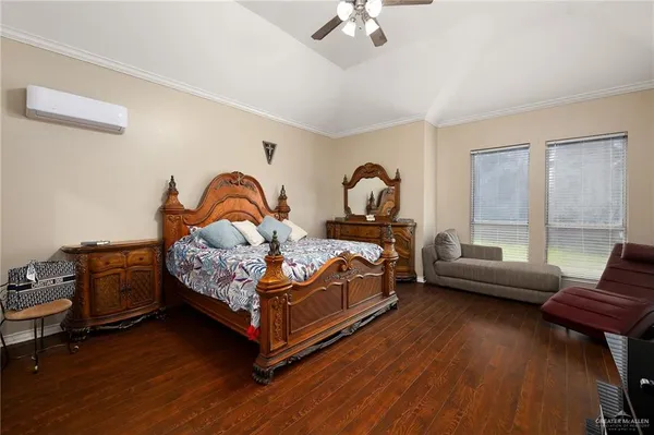 a bedroom with bed and window