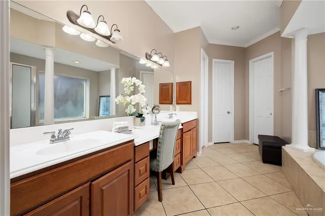 a spacious bathroom with a sink a mirror and a bathtub