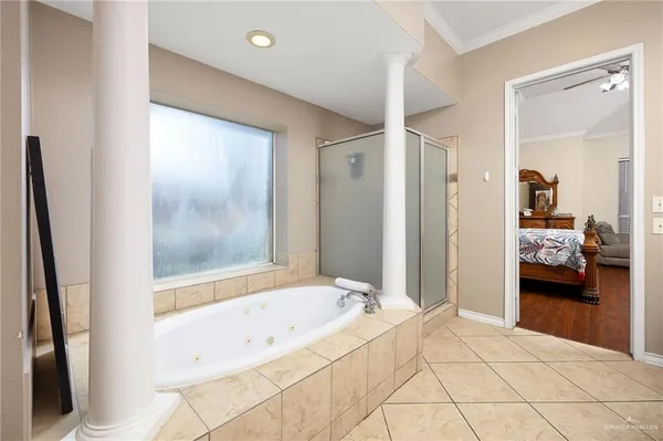 a spacious bathroom with a tub and shower