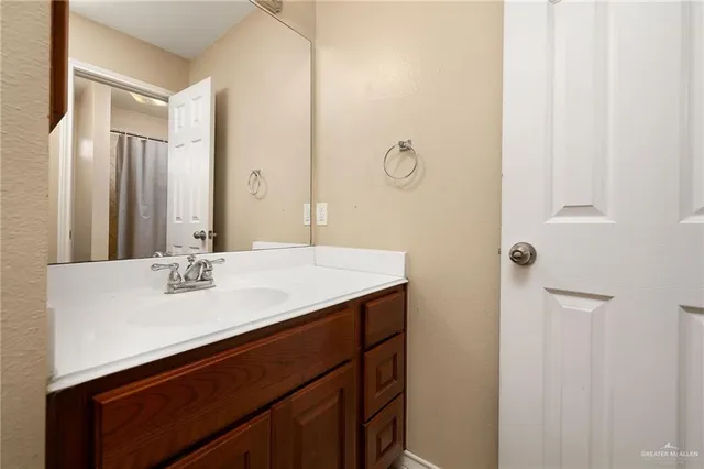 a bathroom with a sink and a mirror