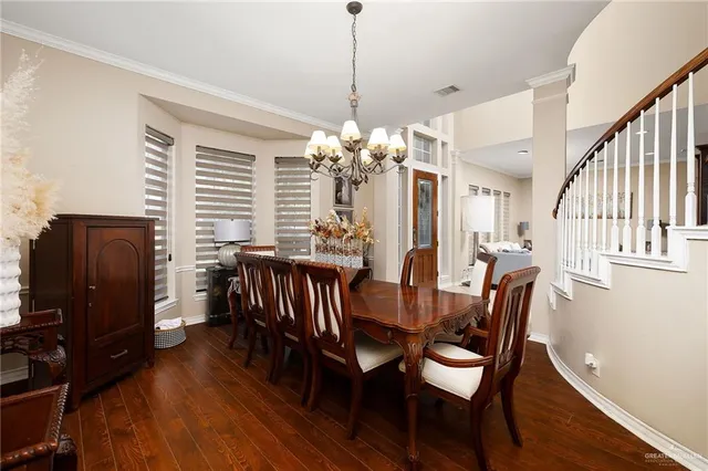 a view of a dining room with furniture and window
