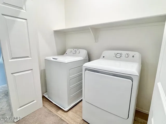 a bathroom with a toilet sink and a mirror
