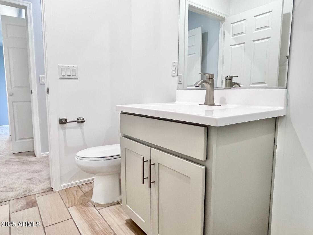 3434 North Longview Avenue, Unit 13 Phoenix, AZ 85014 - Photo 30 of 53 a bathroom with a sink and a toilet