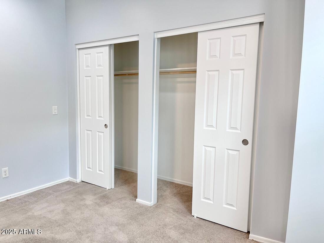 3434 North Longview Avenue, Unit 13 Phoenix, AZ 85014 - Photo 34 of 53 an empty room with closet and a bathroom