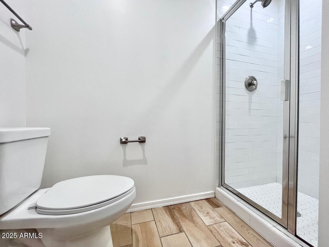3434 North Longview Avenue, Unit 13 Phoenix, AZ 85014 - Photo 42 of 53 a white toilet sitting next to a shower