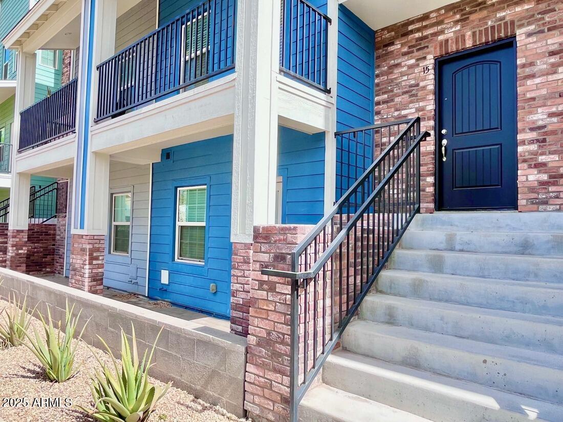 3434 North Longview Avenue, Unit 13 Phoenix, AZ 85014 - Photo 44 of 53 a view of a building with large windows and stairs