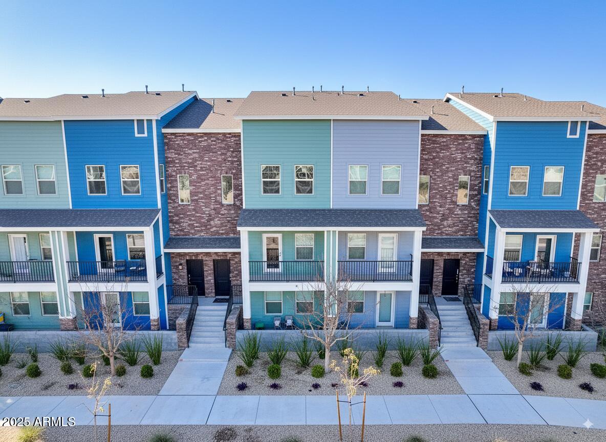 3434 North Longview Avenue, Unit 13 Phoenix, AZ 85014 - Photo 47 of 53 a front view of a building with potted plants